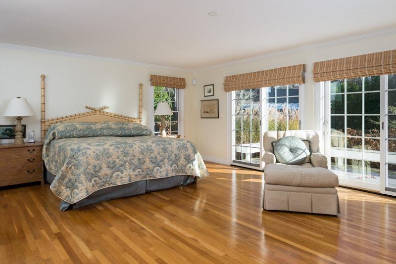 91 Great Bay Road Osterville, MA 02655 - Photo 13 of 27 a bedroom with a bed and glass window