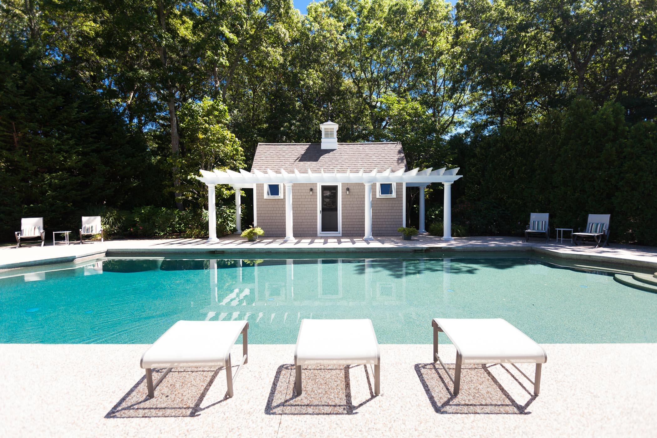 91 Great Bay Road Osterville, MA 02655 - Photo 25 of 27 a view of a white house with a yard table and chairs