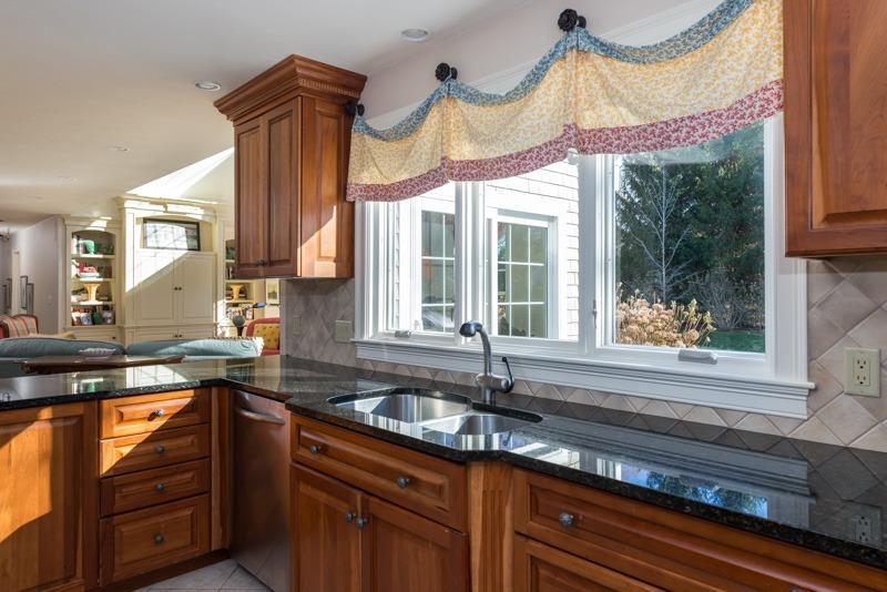91 Great Bay Road Osterville, MA 02655 - Photo 9 of 27 a kitchen with stainless steel appliances granite countertop a sink and a large window