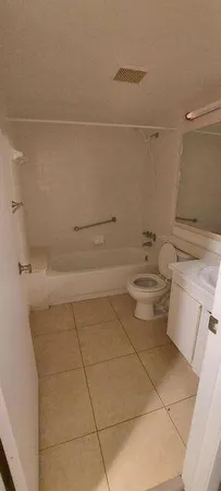 a bathroom with a sink a toilet and vanity