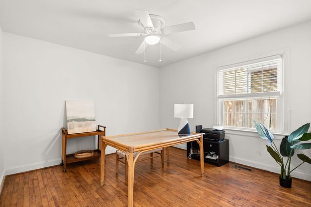 a workspace with furniture and wooden floor