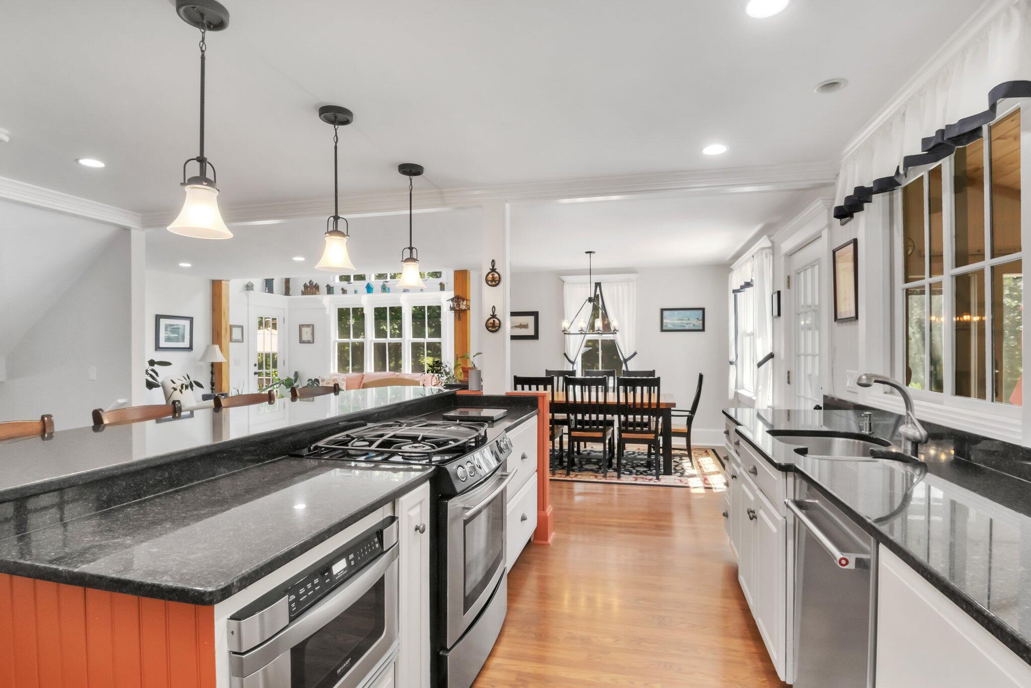 730 Slough Road Brewster, MA 02631 - Photo 24 of 87 a kitchen with stainless steel appliances granite countertop a stove and a sink