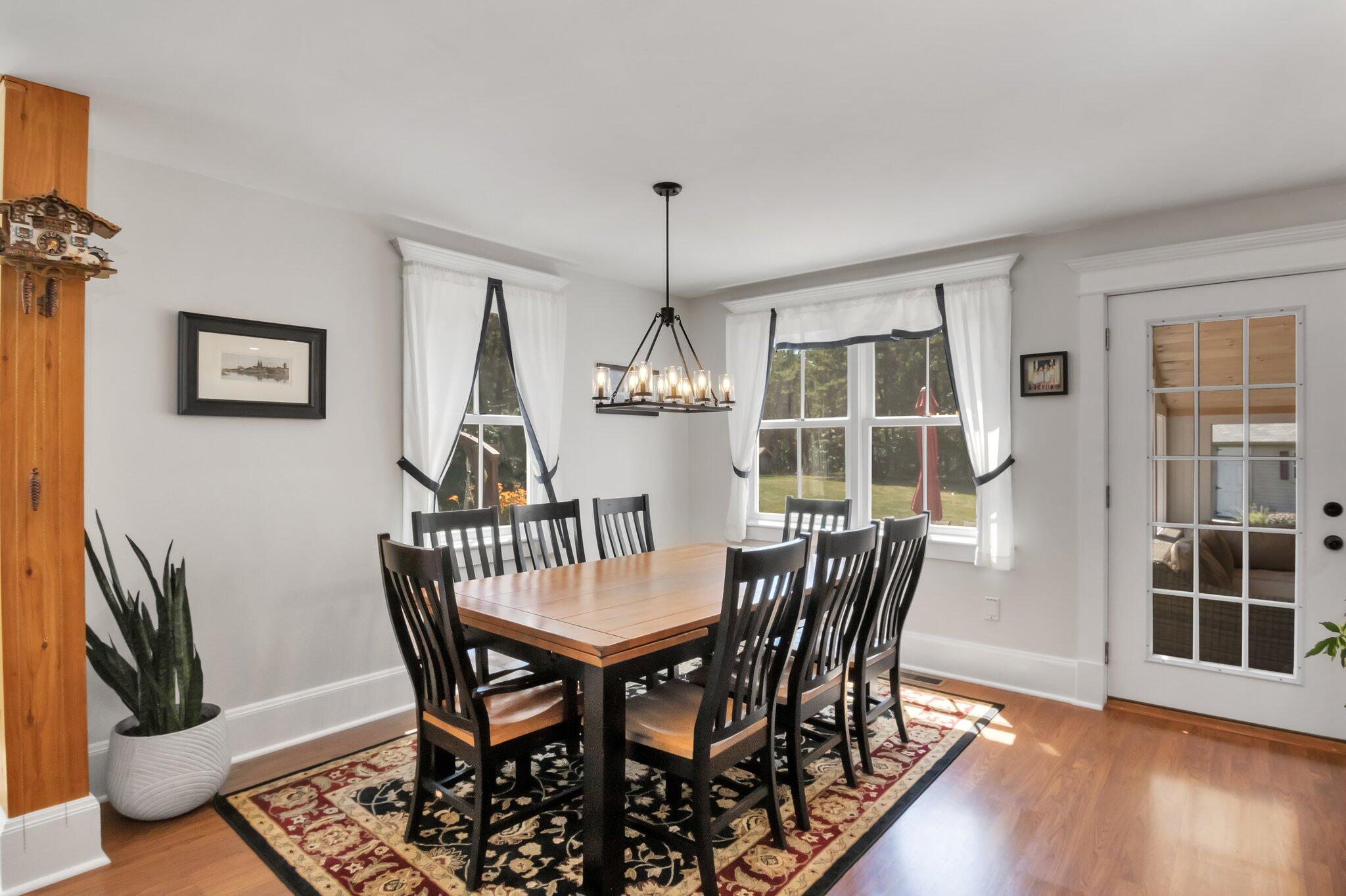 730 Slough Road Brewster, MA 02631 - Photo 26 of 87 a view of a dining room with furniture window and wooden floor