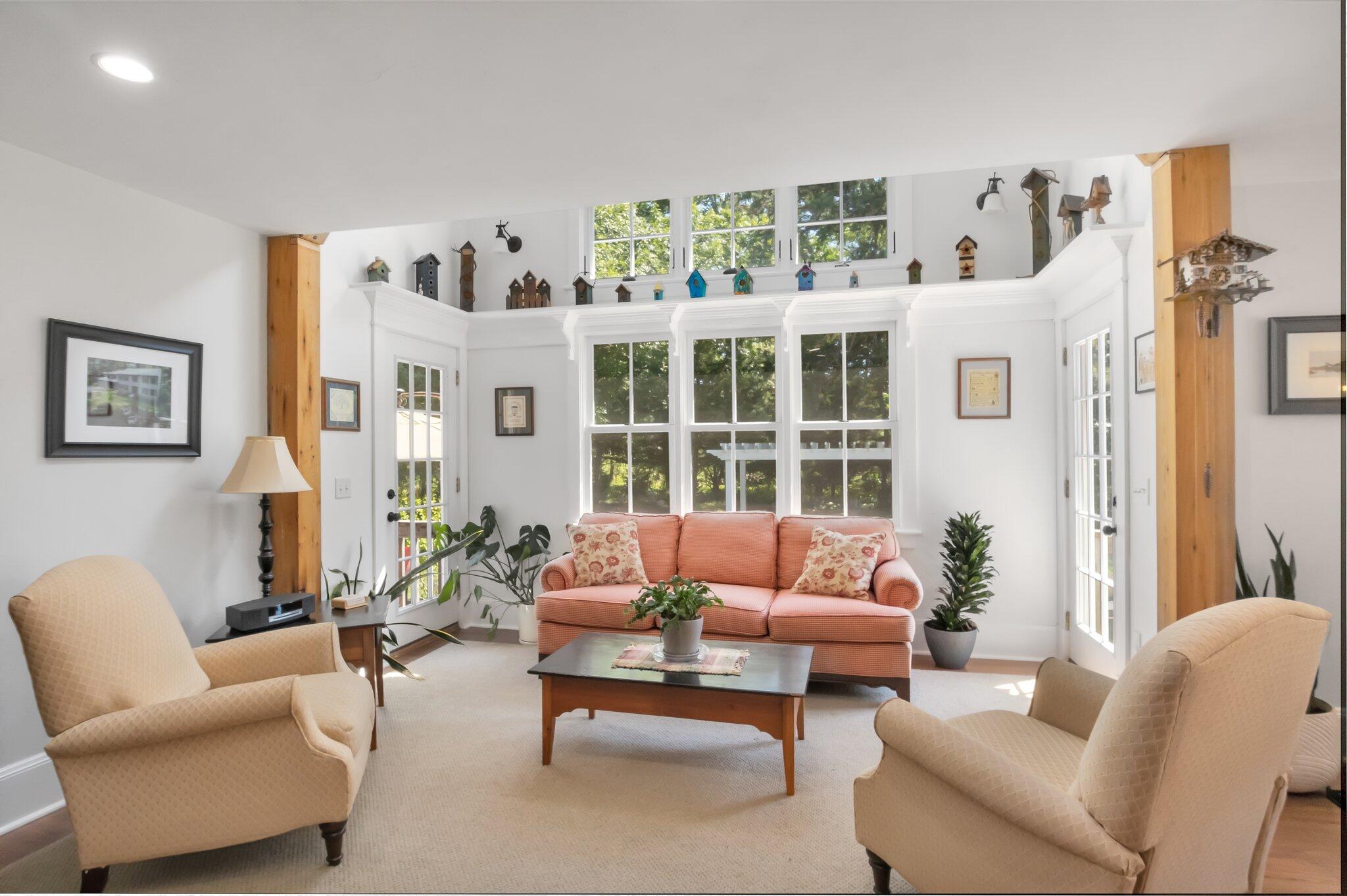 730 Slough Road Brewster, MA 02631 - Photo 27 of 87 a living room with furniture and a large window