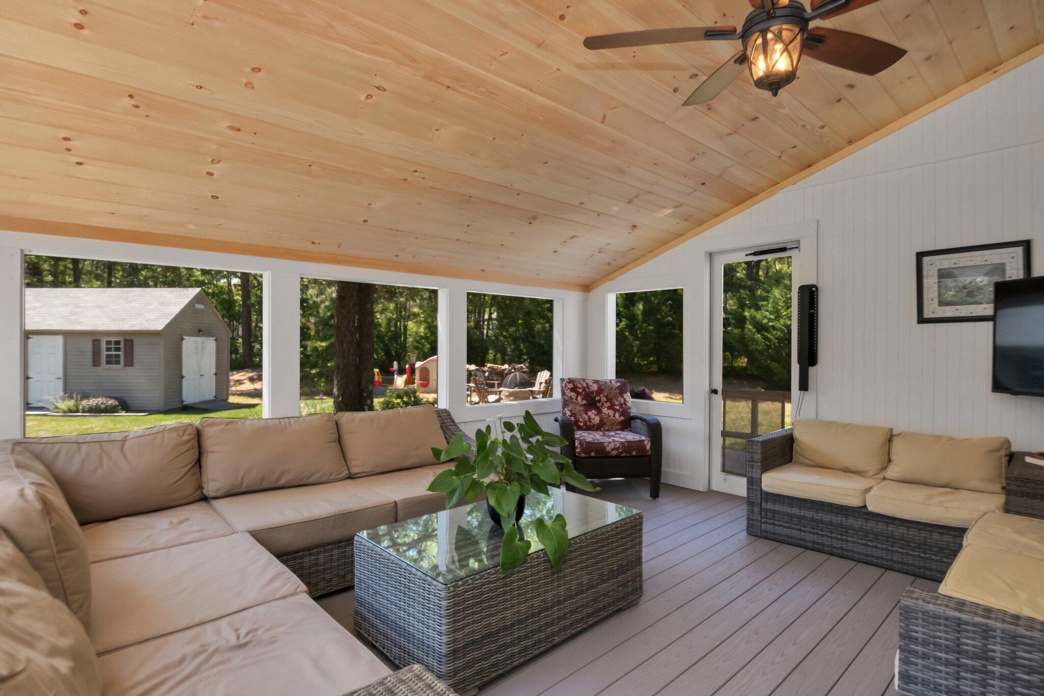 730 Slough Road Brewster, MA 02631 - Photo 34 of 87 a living room with furniture and a large window