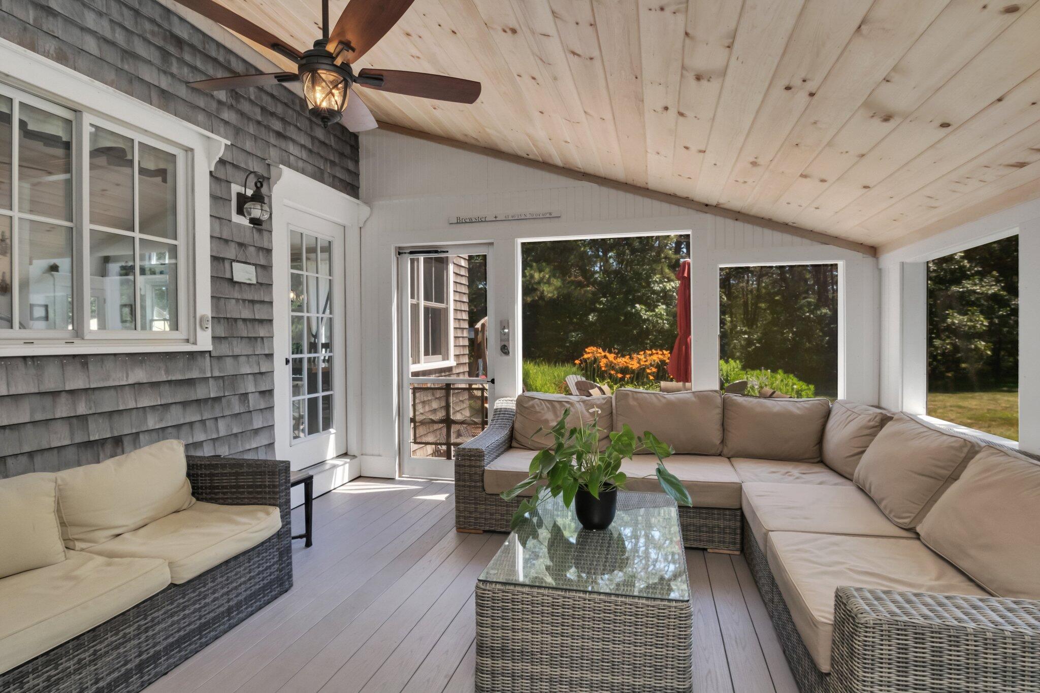730 Slough Road Brewster, MA 02631 - Photo 35 of 87 a living room with furniture and a large window