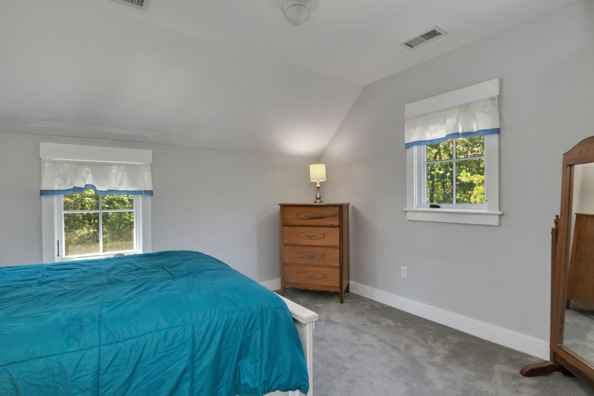 730 Slough Road Brewster, MA 02631 - Photo 47 of 87 a bedroom with a bed and a window