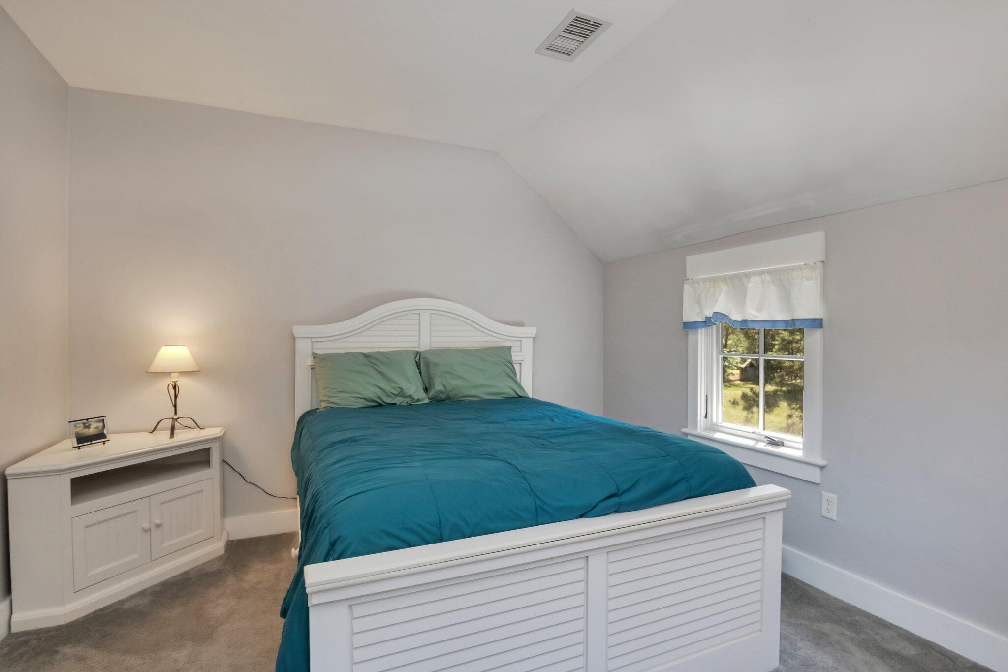 730 Slough Road Brewster, MA 02631 - Photo 48 of 87 a bedroom with a bed and a window