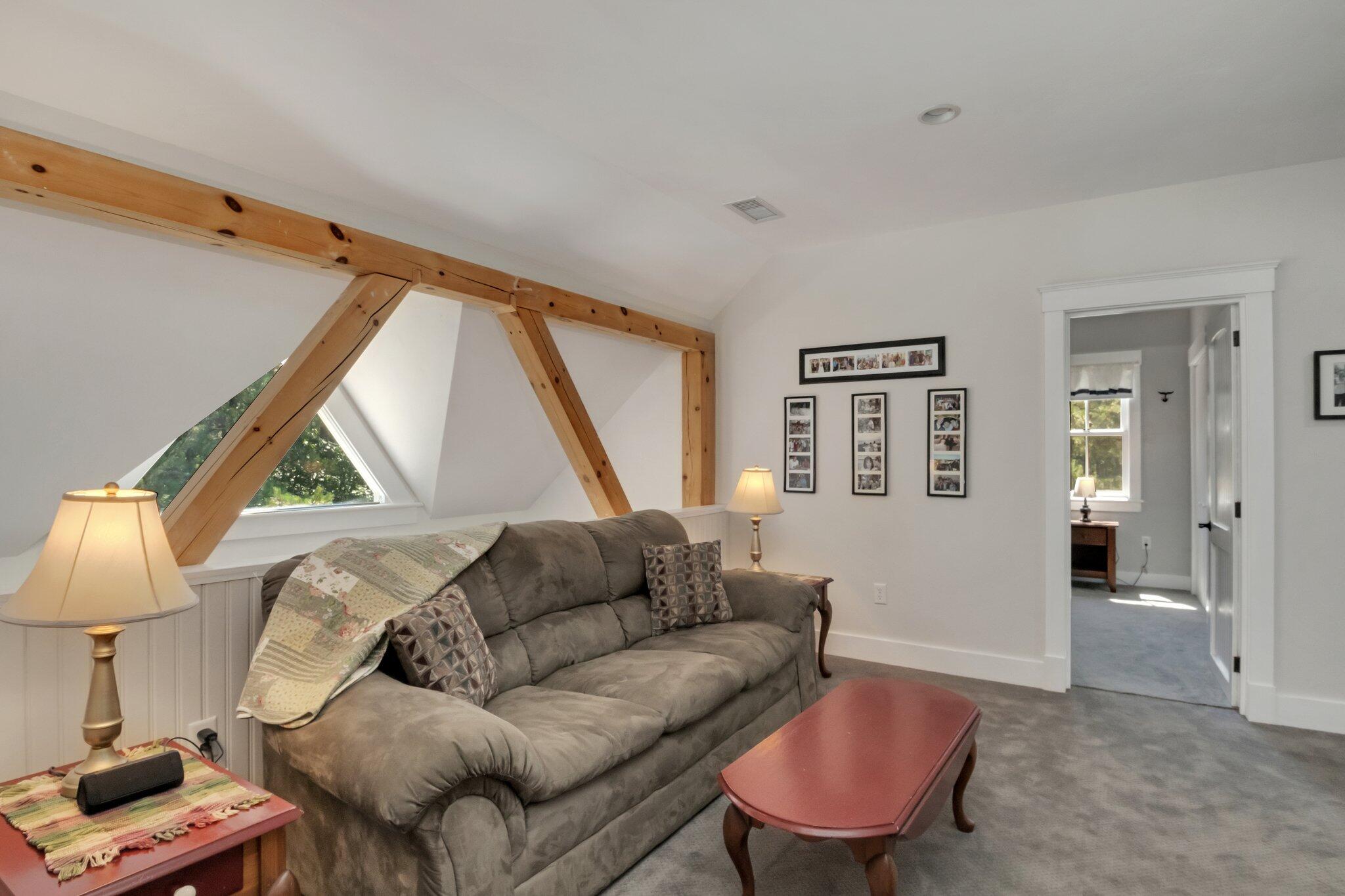 730 Slough Road Brewster, MA 02631 - Photo 49 of 87 a living room with furniture a couch and a window