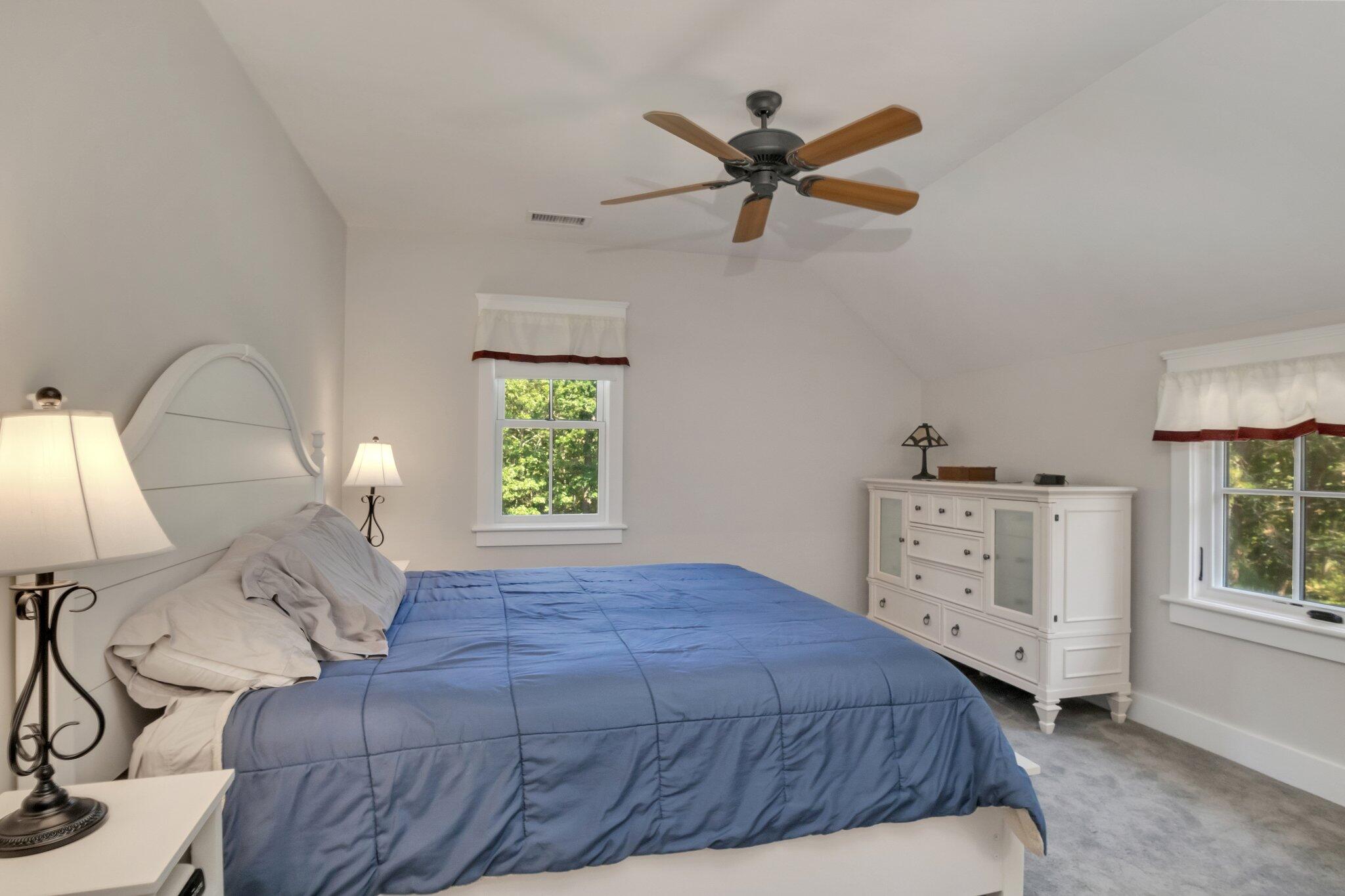 730 Slough Road Brewster, MA 02631 - Photo 50 of 87 a bedroom with a large bed and a window