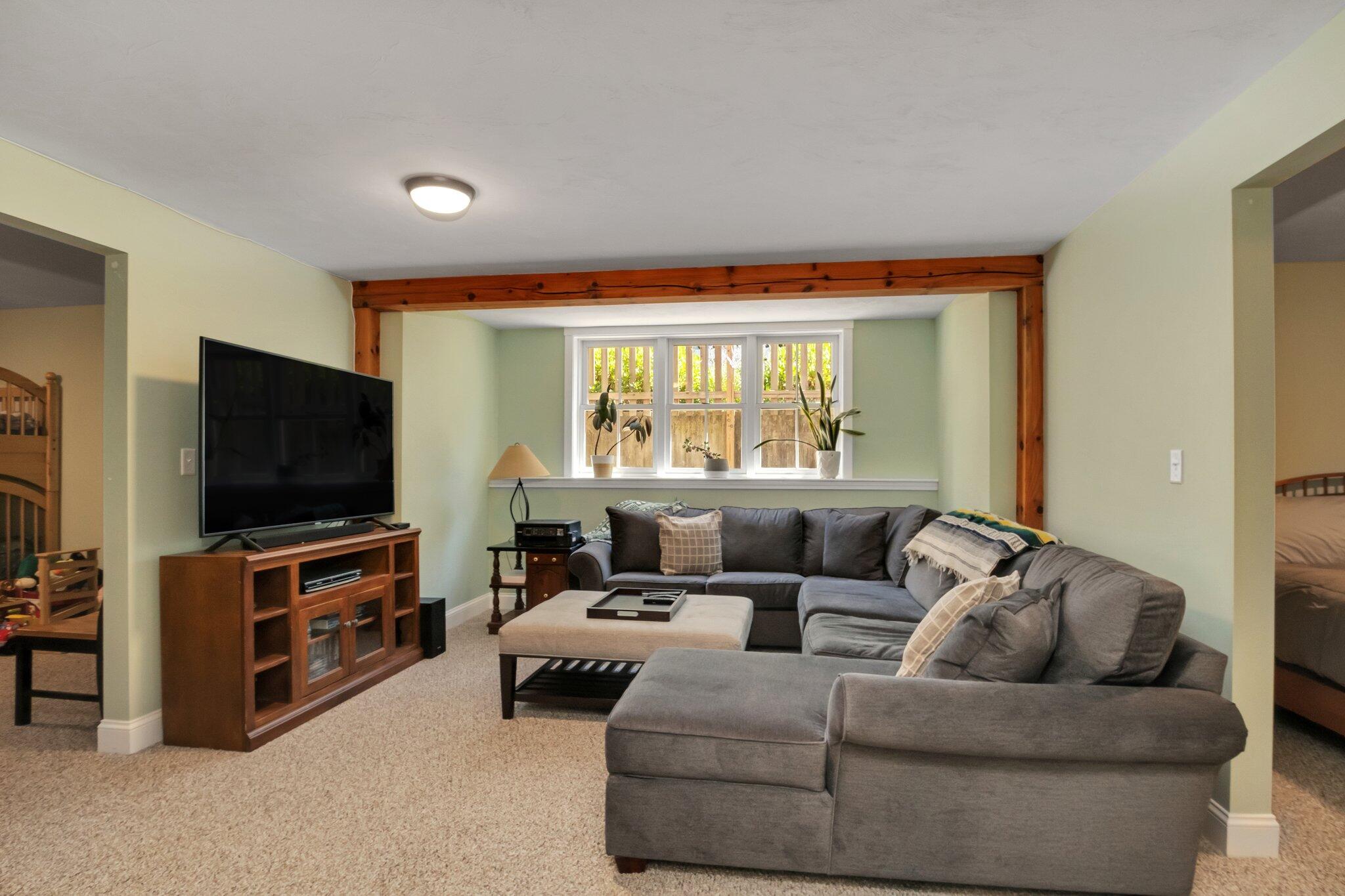 730 Slough Road Brewster, MA 02631 - Photo 57 of 87 a living room with furniture and a flat screen tv