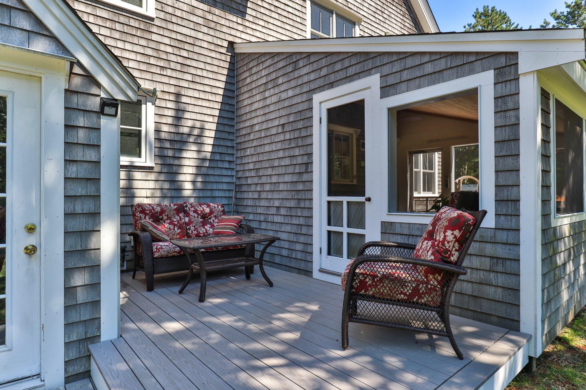 730 Slough Road Brewster, MA 02631 - Photo 67 of 87 a backyard of a house with outdoor seating