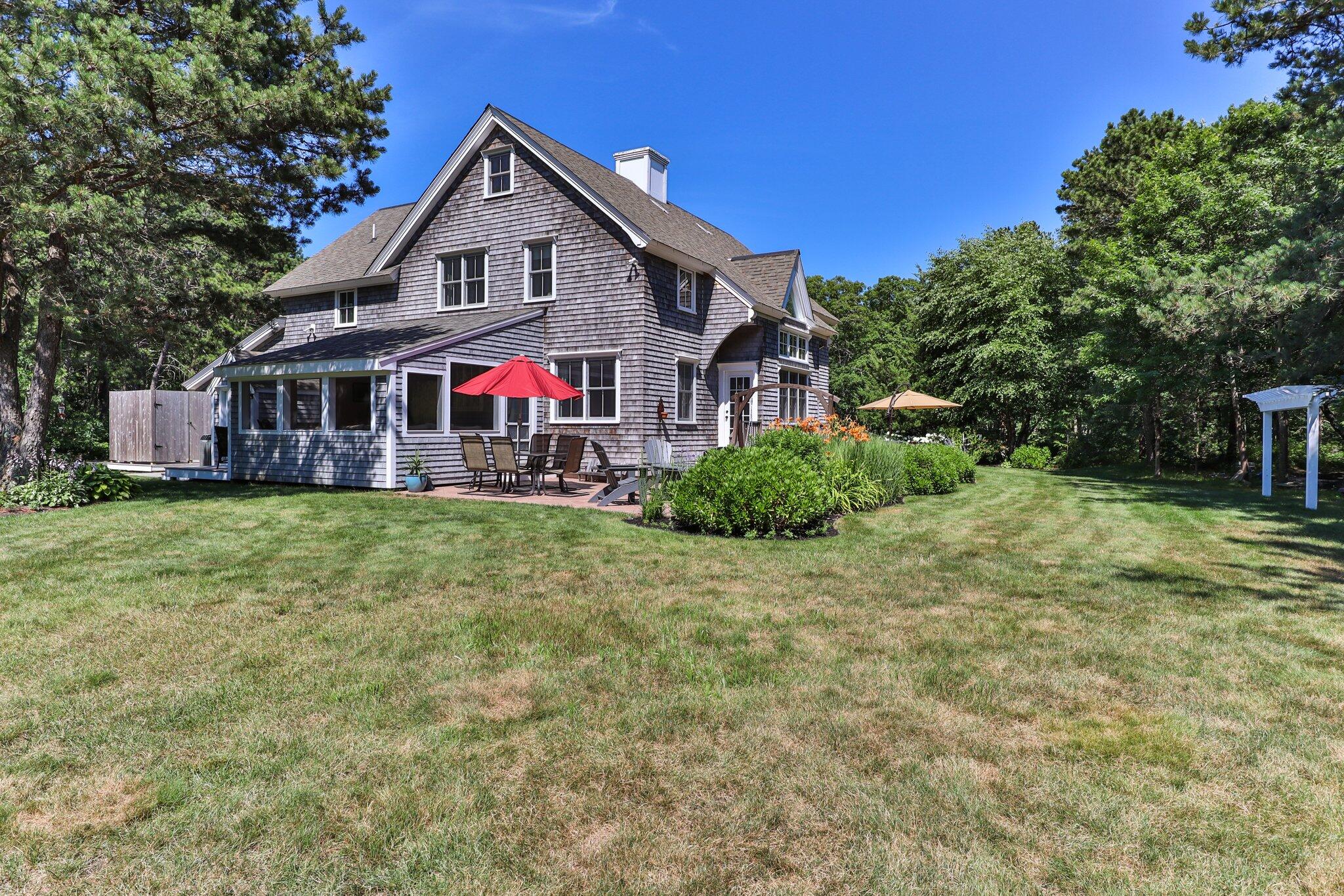 730 Slough Road Brewster, MA 02631 - Photo 73 of 87 a front view of house with yard and green space