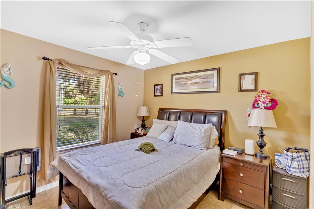 1867 17th Street Southwest Naples, FL 34117 - Photo 18 of 31 Bedroom featuring ceiling fan and light tile patterned floors