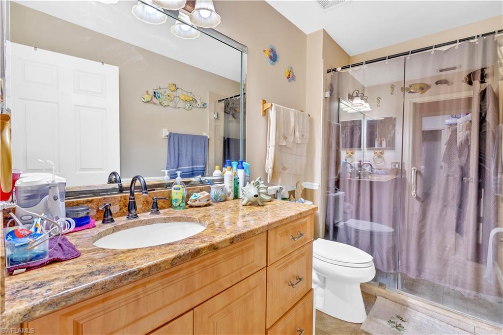 1867 17th Street Southwest Naples, FL 34117 - Photo 20 of 31 Bathroom featuring a shower stall and vanity