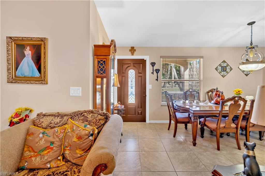 1867 17th Street Southwest Naples, FL 34117 - Photo 6 of 31 Dining space featuring light tile patterned flooring and baseboards
