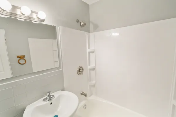 a bathroom with a bathtub and a sink