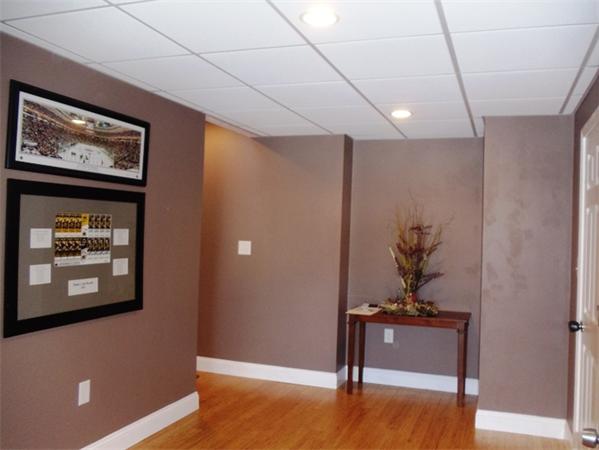 63 Lippold Street Methuen, MA 01844 - Photo 11 of 12 a view of a hallway with paintings on the wall