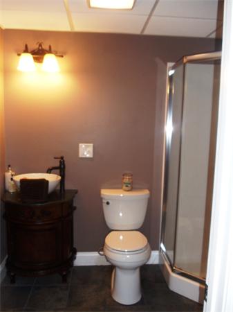 63 Lippold Street Methuen, MA 01844 - Photo 12 of 12 a bathroom with a toilet and a mirror