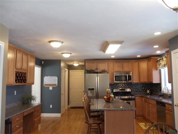 63 Lippold Street Methuen, MA 01844 - Photo 3 of 12 a kitchen with stainless steel appliances a refrigerator sink and microwave