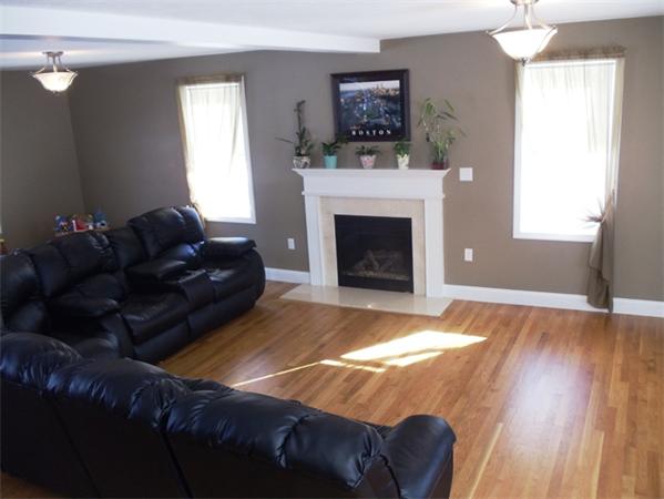 63 Lippold Street Methuen, MA 01844 - Photo 4 of 12 a living room with furniture and a fireplace