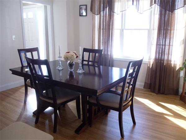 63 Lippold Street Methuen, MA 01844 - Photo 5 of 12 a view of a dining room with furniture window and wooden floor