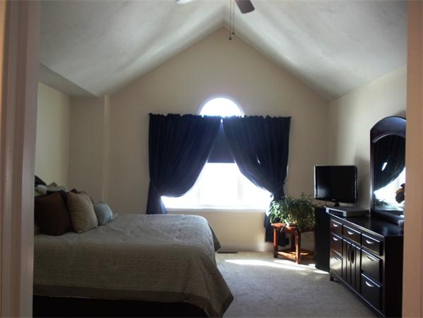 63 Lippold Street Methuen, MA 01844 - Photo 6 of 12 a bedroom with a bed and a flat screen tv