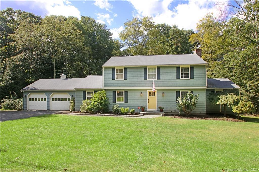 79 Acre Lane Ridgefield, CT 06877 - Photo 1 of 1 a front view of a house with a garden