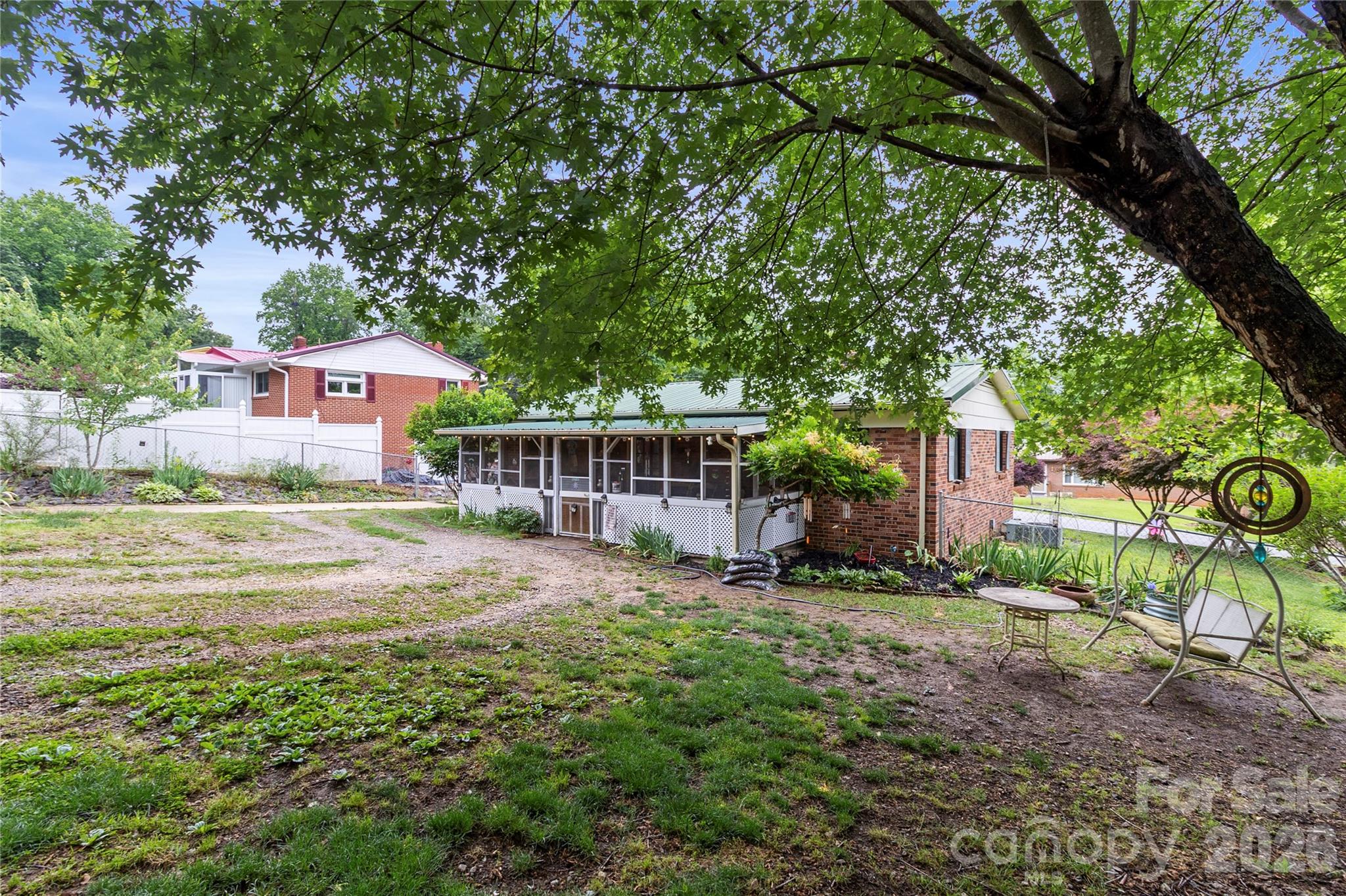 325 Swanson Road Lenoir, NC 28645 - Photo 27 of 35 a view of a house with a yard