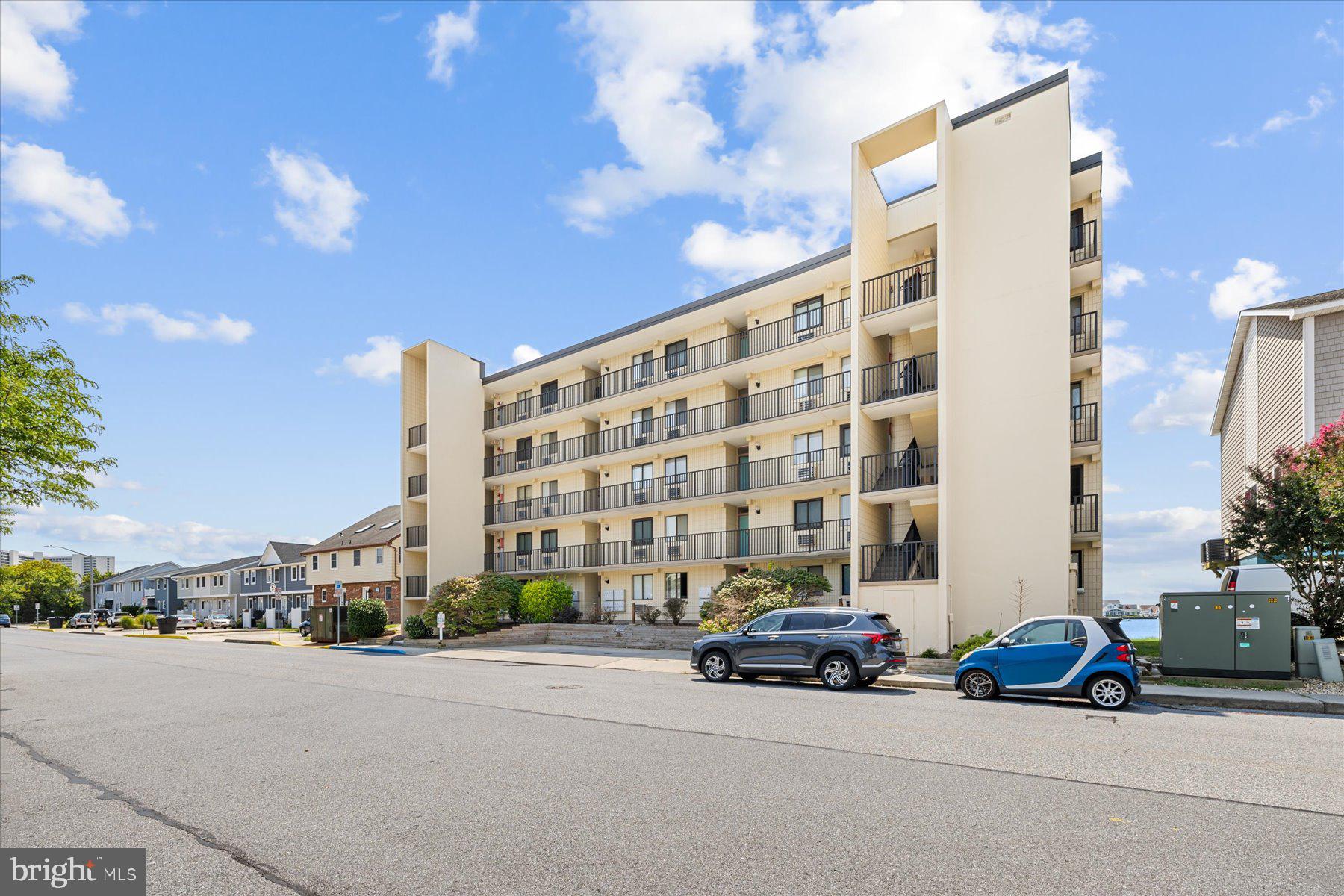 169 Jamestown Road, Unit 503 Ocean City, MD 21842 - Photo 17 of 18 a car parked in front of a building