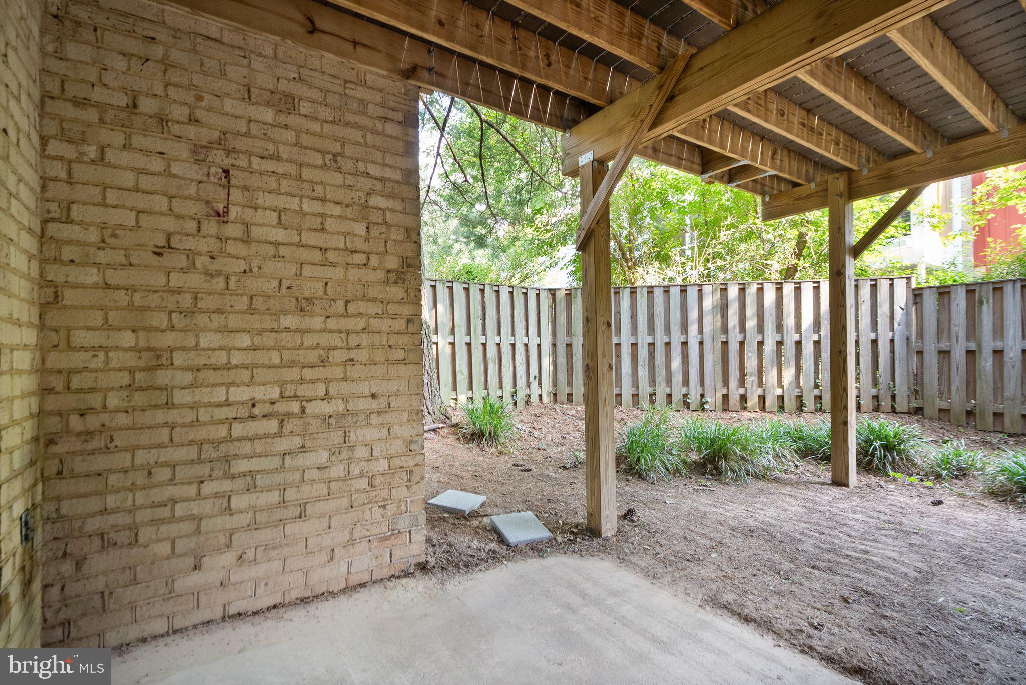11041 Saffold Way Reston, VA 20190 - Photo 40 of 44 Deck Provides Cover for Patio