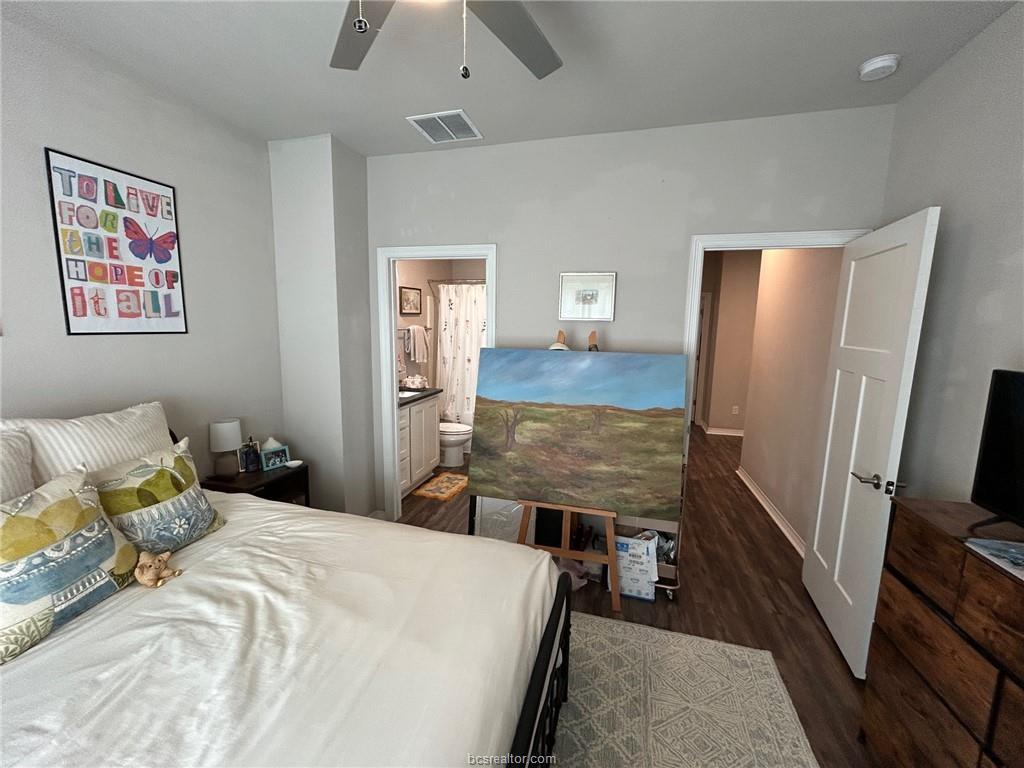 3102 Green Street Bryan, TX 77801 - Photo 14 of 26 a bedroom with a bed and a flat screen tv
