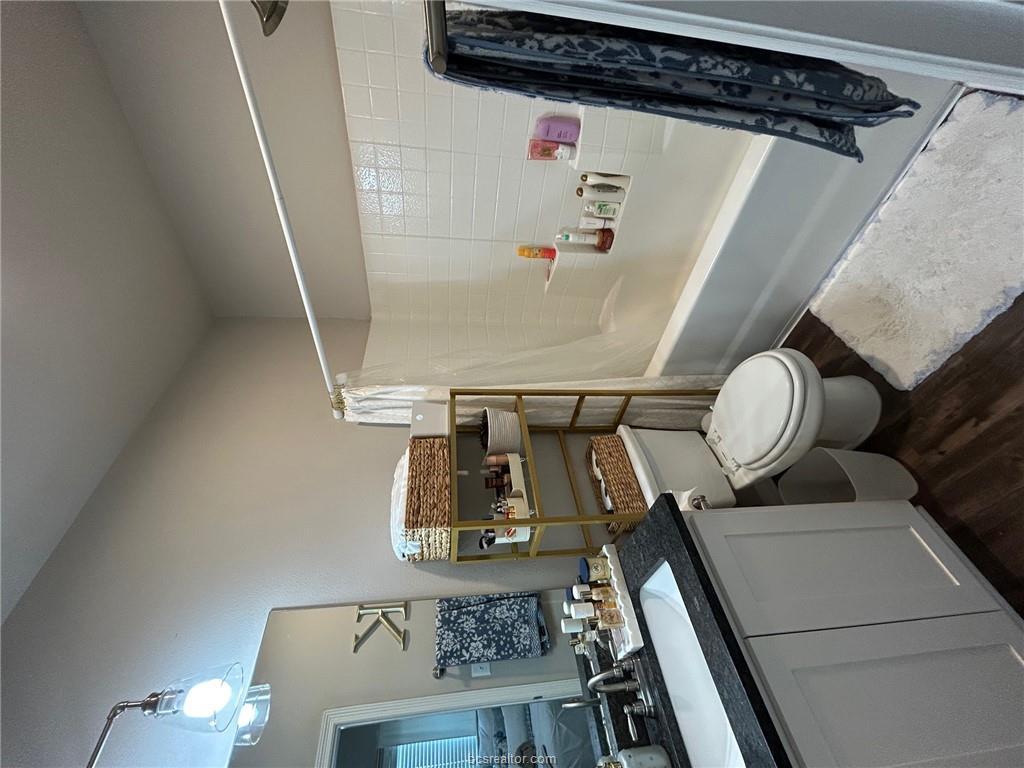 3102 Green Street Bryan, TX 77801 - Photo 18 of 26 a bathroom with a sink toilet and shower
