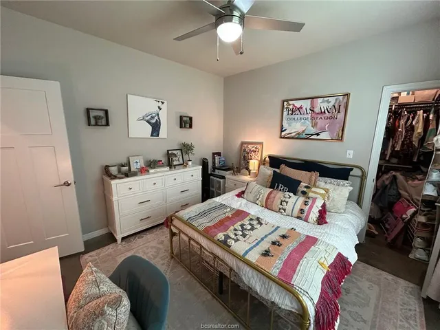 a bedroom with bed and a view of bedroom