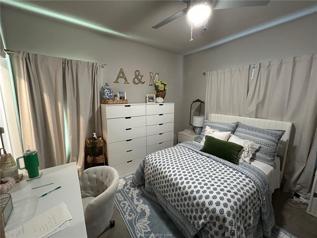 3102 Green Street Bryan, TX 77801 - Photo 10 of 26 a bedroom with a bed and wooden floor