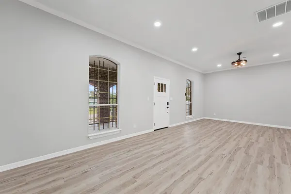 a view of an empty room with a window