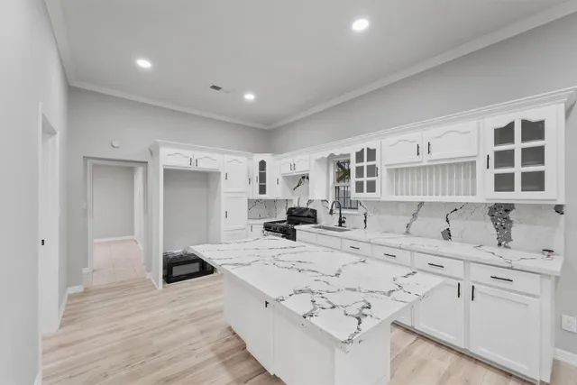 a bathroom with a sink a mirror and shower