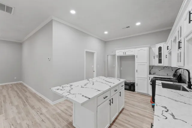a white sink sitting next to a white sink