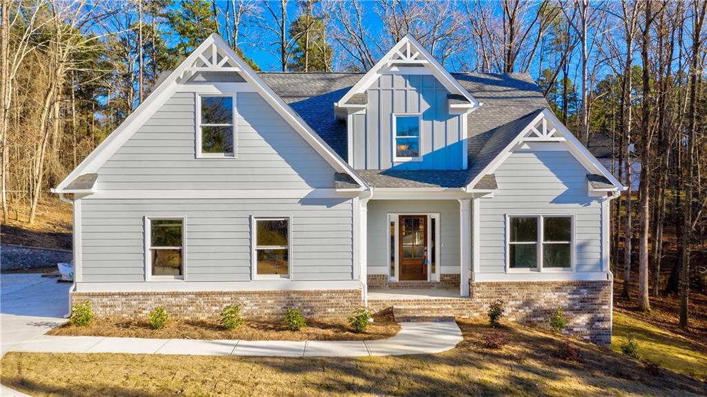 3981 Bolding Road Flowery Branch, GA 30542 - Photo 1 of 1 a front view of a house with a yard