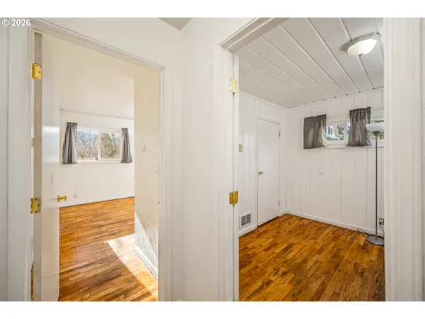 a view of an entryway with wooden floor