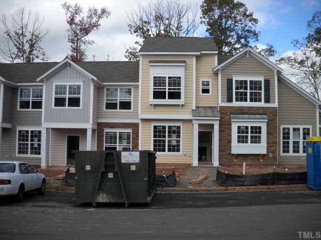 1709 Grace Point Road, Unit 58 Morrisville, NC 27560 - Photo 3 of 3 a front view of a house with a yard