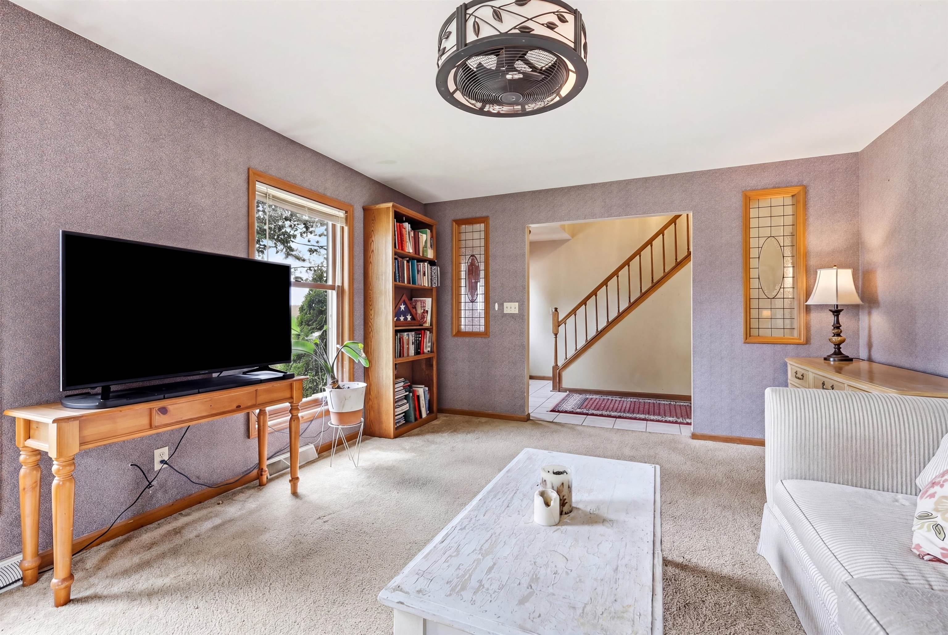 13 Signal Point Lane Galena, IL 61036 - Photo 5 of 47 a living room with furniture and a flat screen tv