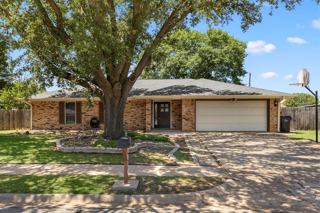 4814 Rhea Road Wichita Falls, TX 76308 - Photo 1 of 1 Ranch-style house featuring an attached garage, driveway, and brick siding