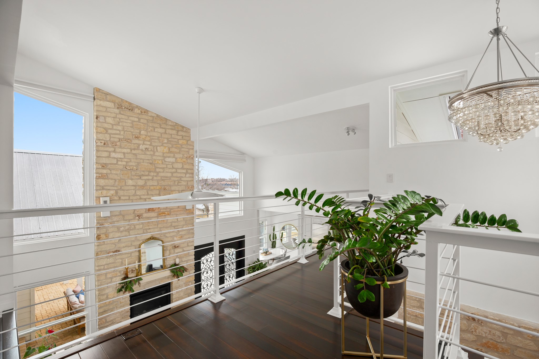 1813 Crooked Lane Austin, TX 78741 - Photo 21 of 39 a potted plant sitting on top of a wooden floor