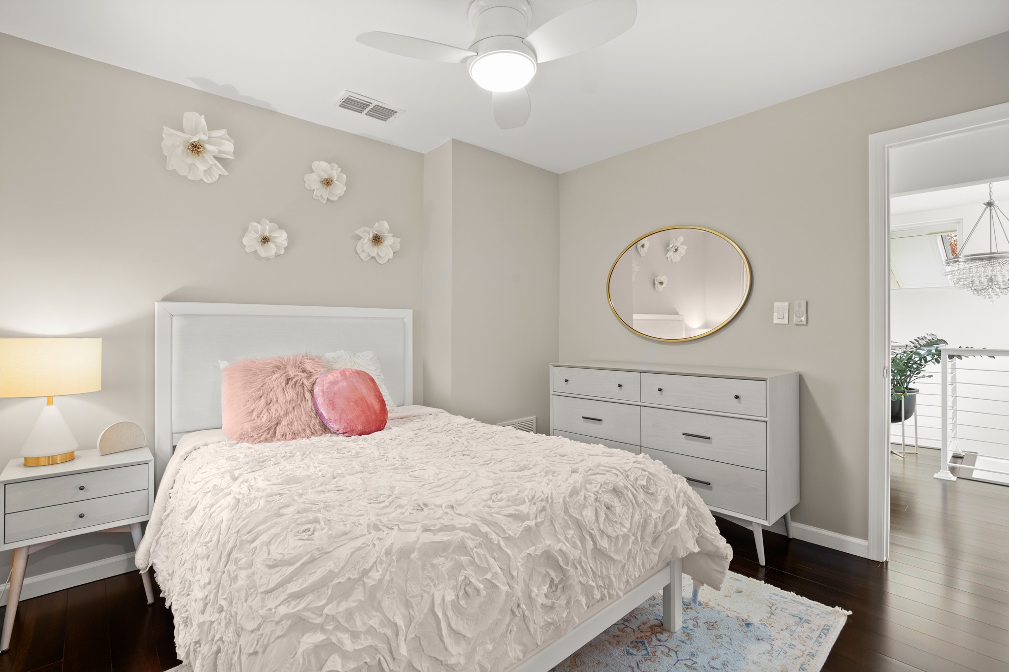1813 Crooked Lane Austin, TX 78741 - Photo 22 of 39 a bedroom with a bed and wooden floor