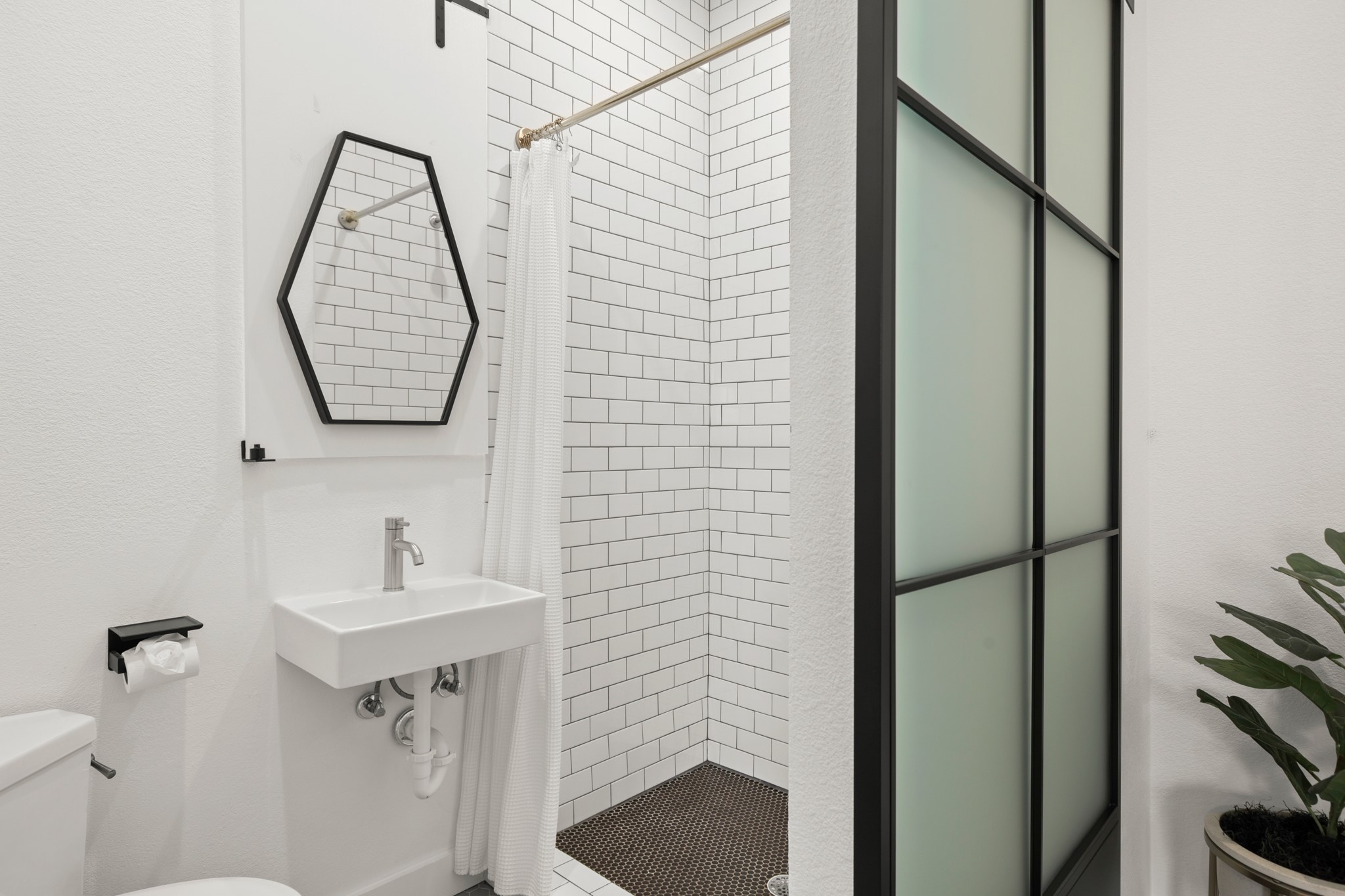 1813 Crooked Lane Austin, TX 78741 - Photo 31 of 39 a bathroom with a sink toilet and shower