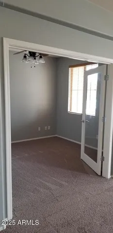 a view of an empty room with a window