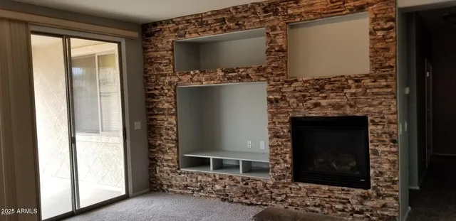 a living room with a fireplace