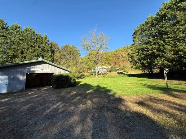 a view of a house with a yard