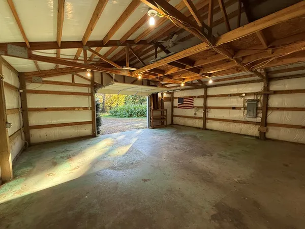 a view of empty room with wooden ceiling